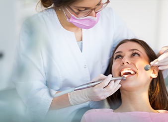 Woman receiving dental exam