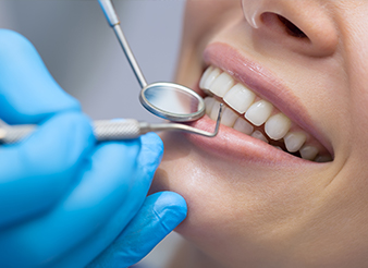 Closeup of patient receiving dental treatment