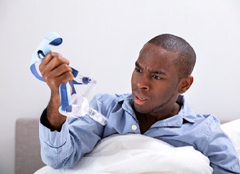 young man frustrated with CPAP 
