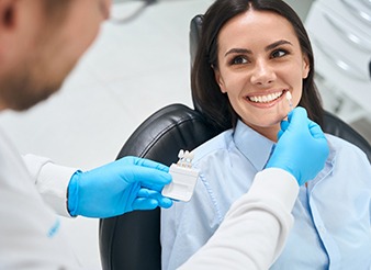 A woman getting a dental crown at the dentist