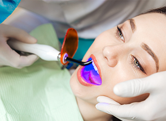 Woman receiving dental bonding