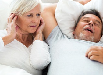 man snoring woman annoyed