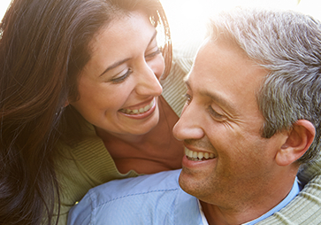 Smiling older man and woman outdoors