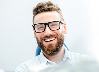 Laughing man in dental chair