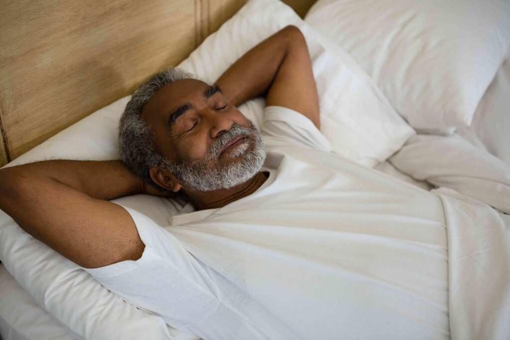 Man laying in a bed