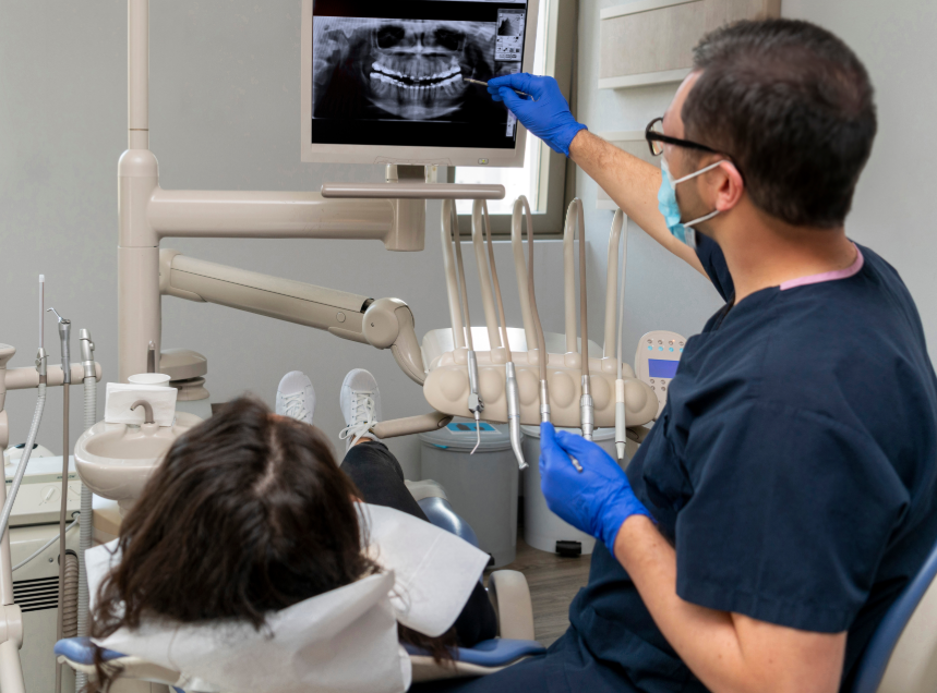 Dentist showing patient x-ray